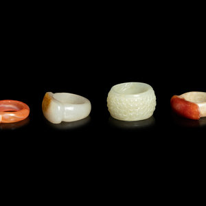 Appraisal: Four Chinese Jade and Hardstone Archer's Rings TH- TH CENTURY