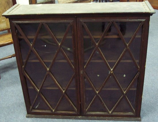 Appraisal: A hanging wall cabinet or bureau bookcase top enclosed by