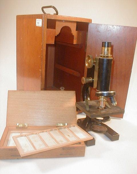 Appraisal: An R J Beck black and brass lacquered monocular microscope