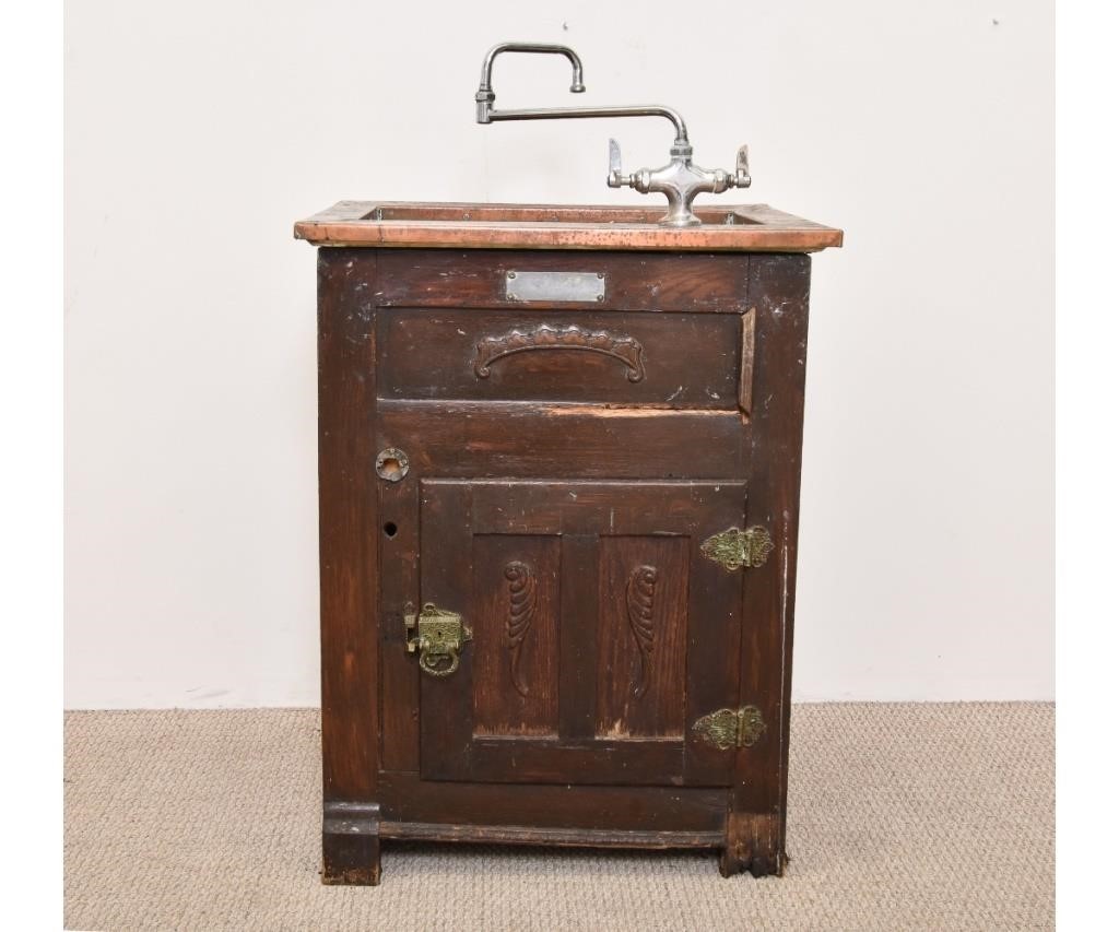 Appraisal: Oak icebox converted to a copper-lined sink circa On any