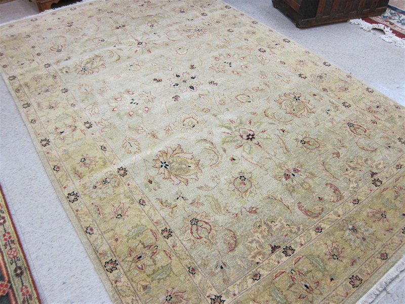 Appraisal: HAND KNOTTED ORIENTAL CARPET Pakistani-Persian overall floral design on light