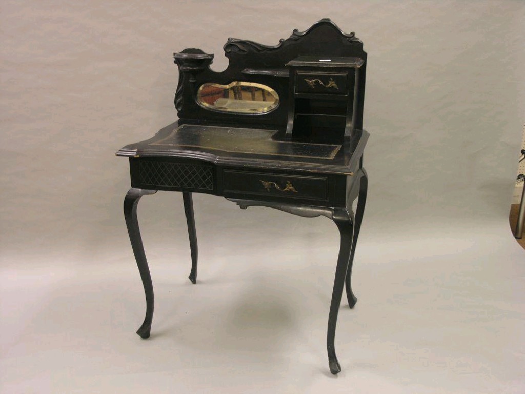 Appraisal: A Victorian Art Nouveau ebonised writing table asymmetric form with