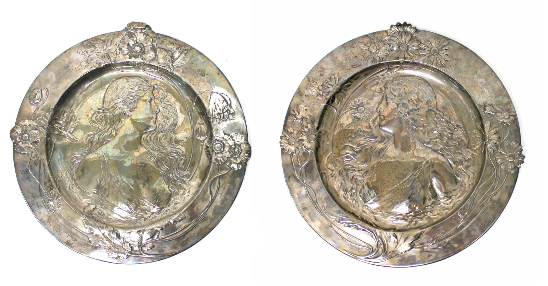 Appraisal: A pair of WMF Art Nouveau silvered metal wall chargers