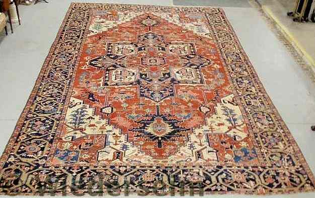 Appraisal: Fine palace size Heriz oriental carpet with a tomato red