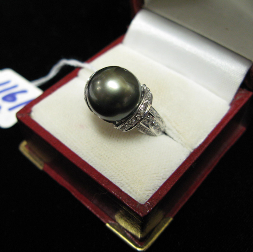 Appraisal: SOUTH SEAS PEARL DIAMOND AND FOURTEEN KARAT WHITE GOLD RING