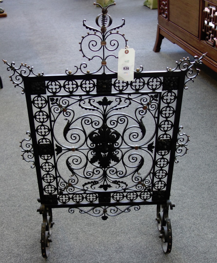 Appraisal: A late th century wrought iron brass and copper fire