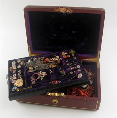 Appraisal: A th century leather jewellery casket damaged containing various items