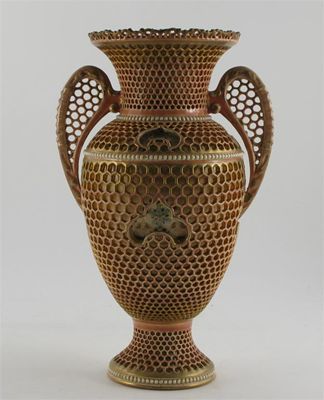 Appraisal: A Zsolnay Pecs pottery reticulated vase twin-handled form printed and