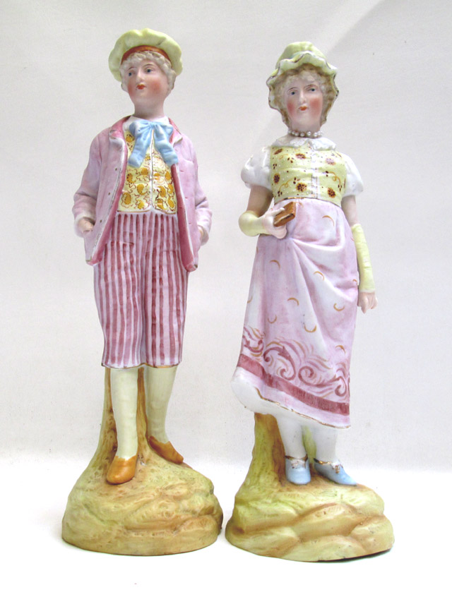 Appraisal: PAIR BISQUE FIGURES depicting boy and girl in th century