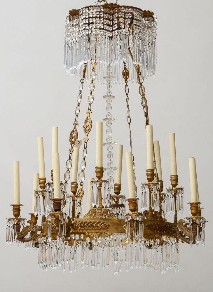 Appraisal: EMPIRE STYLE CUT-GLASS AND GILT-METAL SIXTEEN-LIGHT CHANDELIER The primary annulus