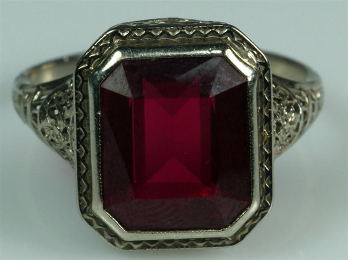 Appraisal: K filigree WG red stone ring x mm red stone