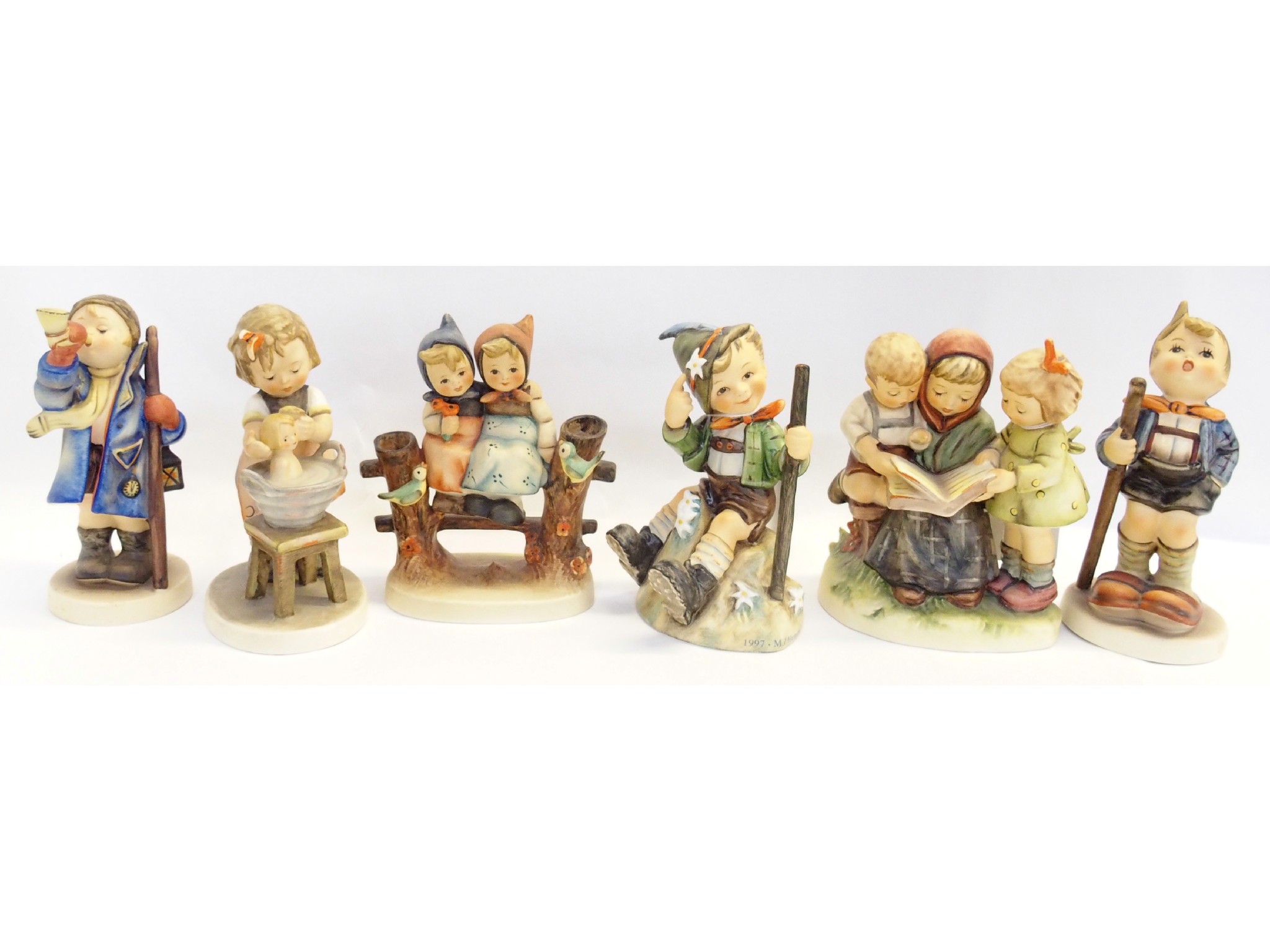 Appraisal: Six Hummel figures comprising Mountaineer TMK Little Hiker TMK Coquettes