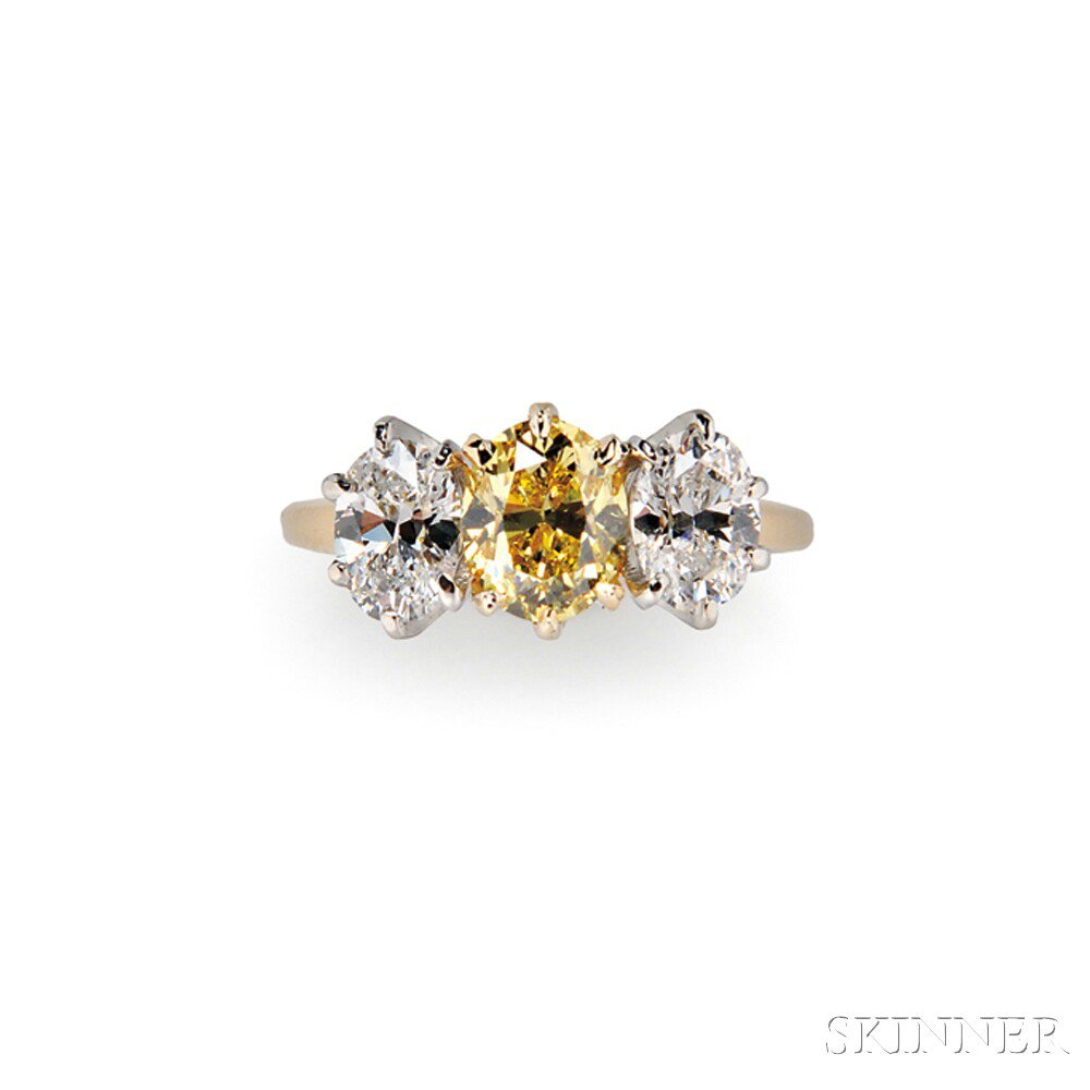 Appraisal: Colored Diamond and Diamond Ring prong-set with an oval-cut yellow