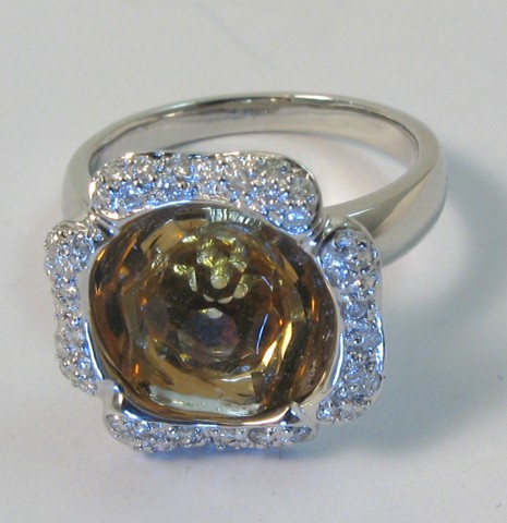 Appraisal: CITRINE AND EIGHTEEN KARAT GOLD RING centering a briolette citrine