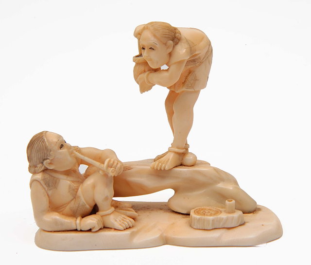 Appraisal: A Japanese ivory okimono of two fishermenMeiji period - one