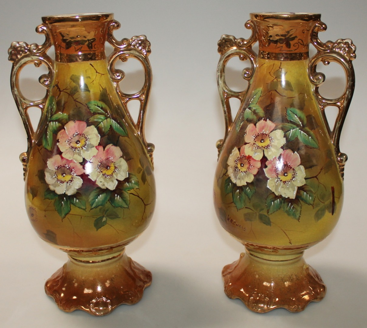 Appraisal: A pair of Edwardian vases each bulbous body hand painted