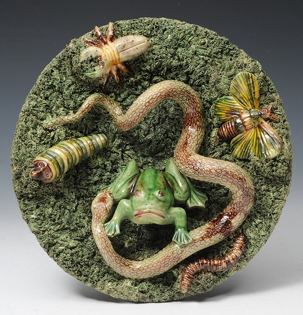 Appraisal: A PORTUGUESE PALISSY STYLE SMALL CHARGER with toad resting on