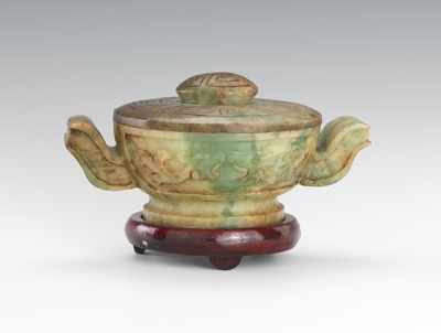 Appraisal: A Small Chinese Jade Jar with Lid Small carved jade