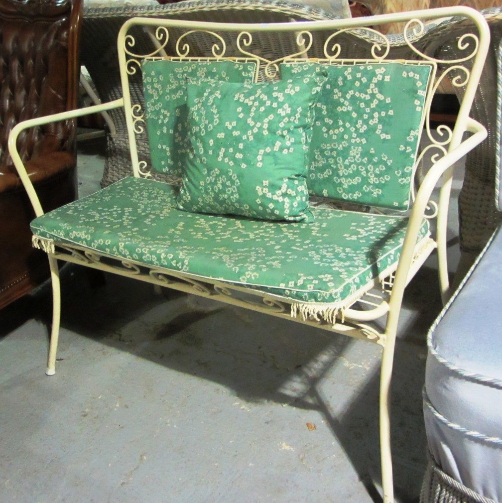 Appraisal: A th century cream painted wrought iron bench