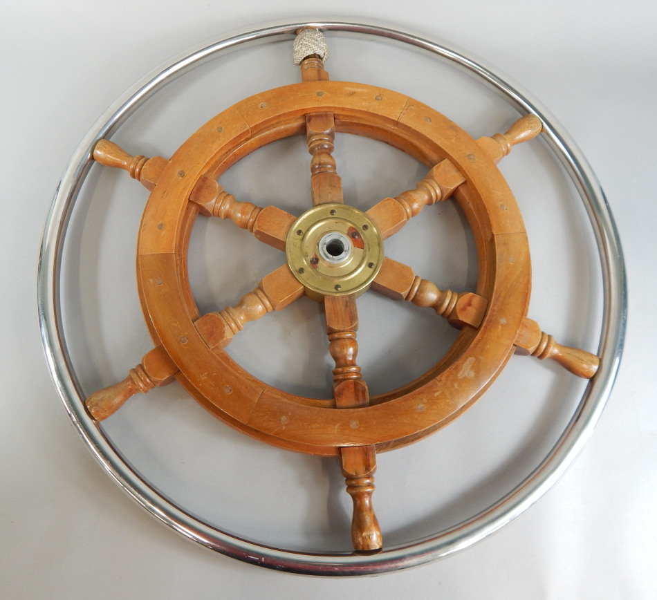 Appraisal: A teak and chrome plated ship's wheel with central brass