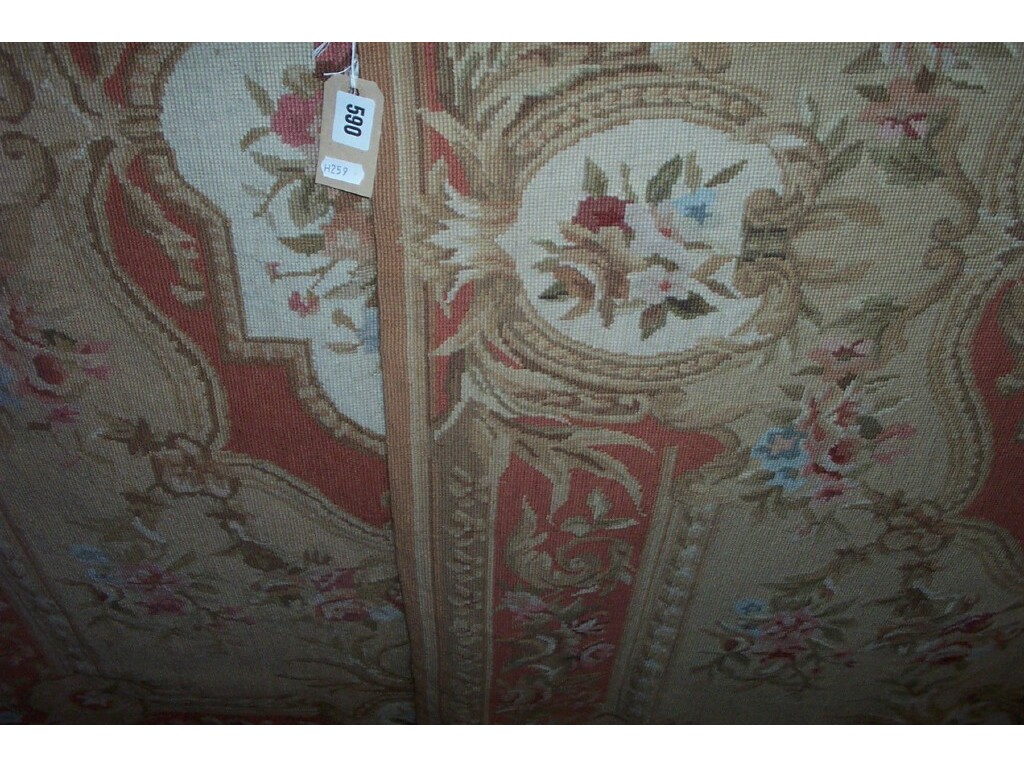 Appraisal: A pair of Aubusson style needlework rugs with floral decoration