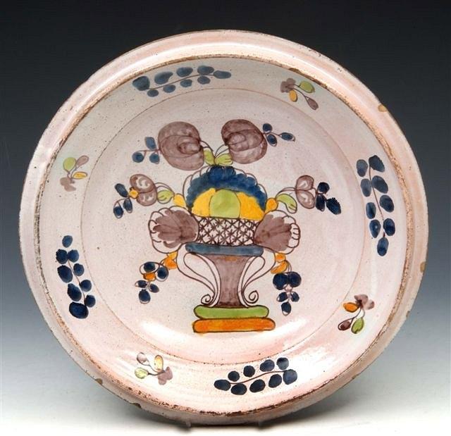 Appraisal: A GERMAN POLYCHROME SHALLOW BOWL with a central design of