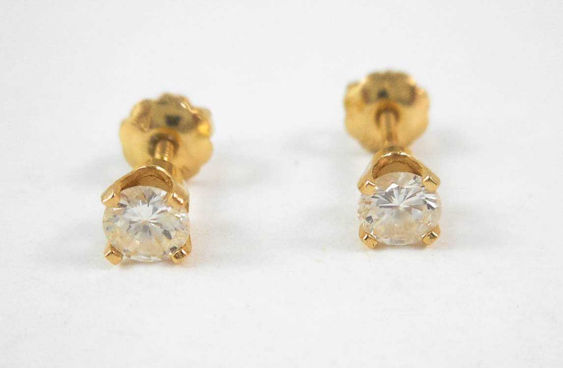 Appraisal: PAIR OF DIAMOND AND YELLOW GOLD EAR STUDS Each k