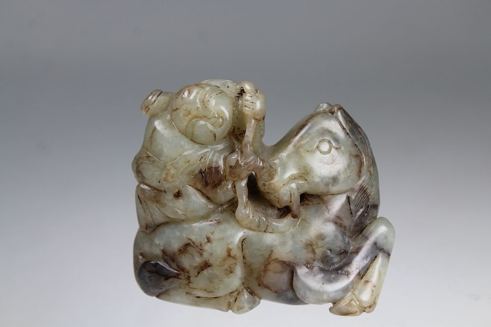 Appraisal: Chinese Carved Figure on Animal Chinese Carved Figure on Animal