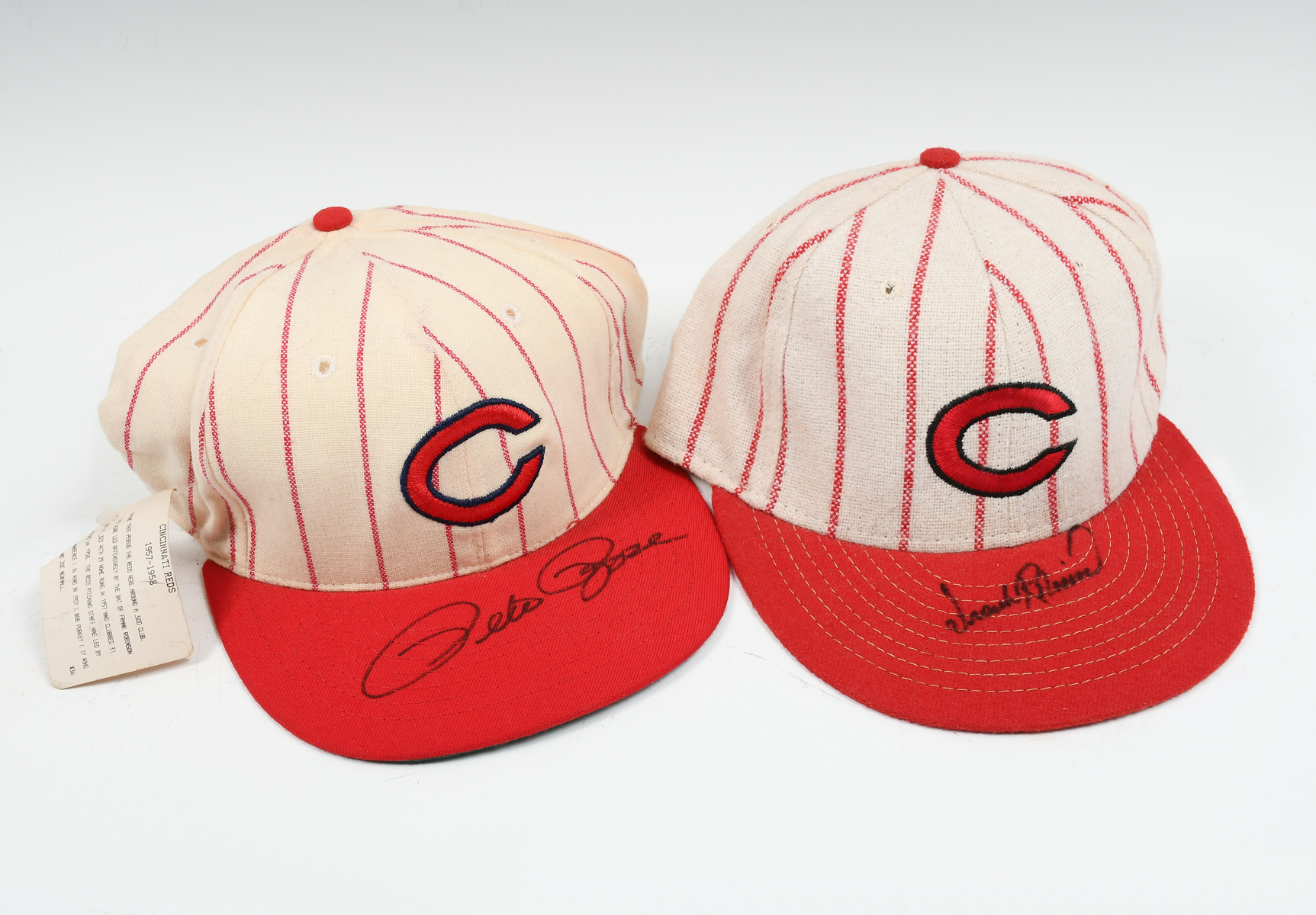 Appraisal: TWO SIGNED CINCINATTI REDS HATS ROBINSON RHODES Old-school pinstriped hats