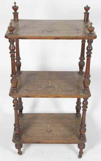 Appraisal: A Victorian walnut three-tier tag re the canted rectangular tiers