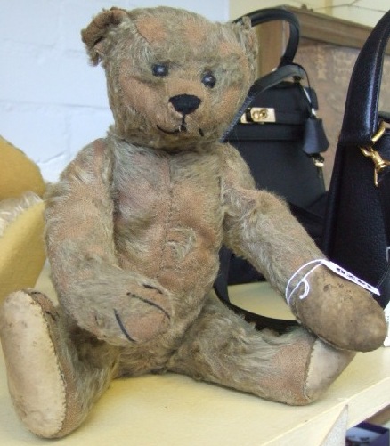 Appraisal: A Stieff teddy bear with golden fur wooden bead eyes