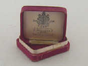 Appraisal: A Russian jewellery box of reddish-pink silk the cream silk