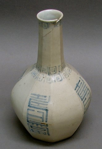 Appraisal: Octagonal bottle form with pale blue symbols on neutral ground