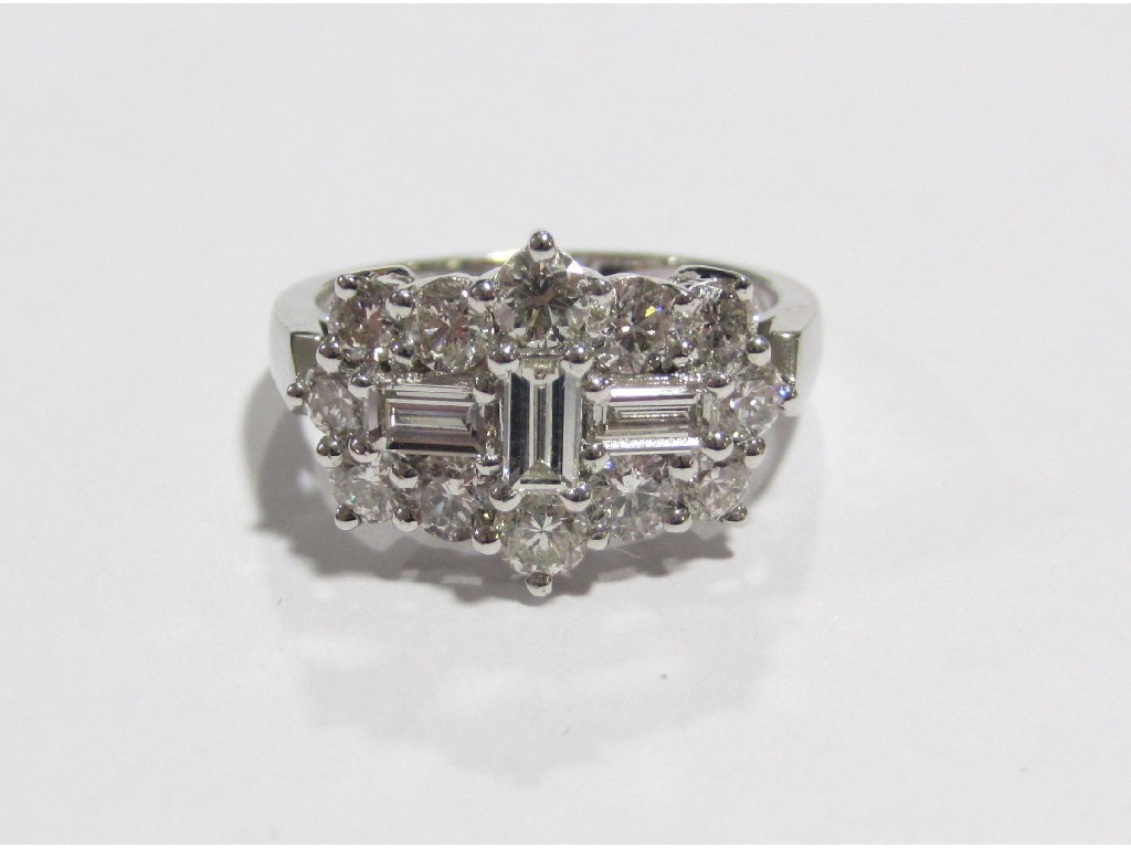 Appraisal: An eighteen carat white gold diamond cluster ring with a