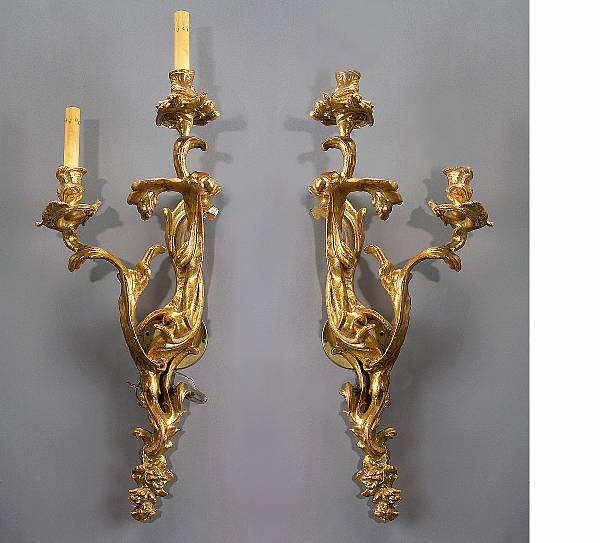 Appraisal: A pair of Louis XV style carved giltwood two-light bras