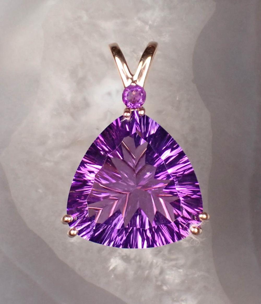 Appraisal: AMETHYST AND FOURTEEN KARAT ROSE GOLD PENDANT with a round-cut