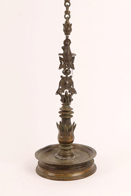 Appraisal: A MIDDLE EASTERN BRONZE HANGING LAMP with attached chain bird