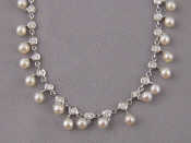 Appraisal: A white metal tests carat gold cultured pearl and diamond