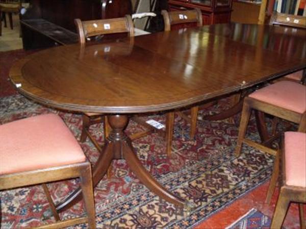 Appraisal: A Regency style twin pedestal mahogany dining table