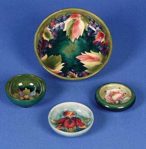 Appraisal: A MOORCROFT SHALLOW BOWL on pedestal foot the shaded green