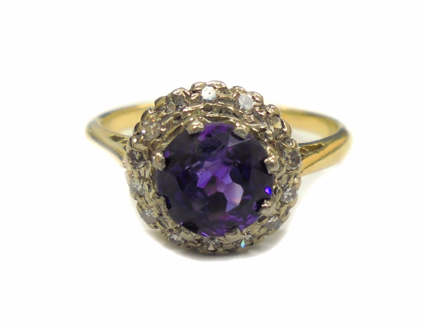 Appraisal: An amethyst and diamond cluster ring centred with a round