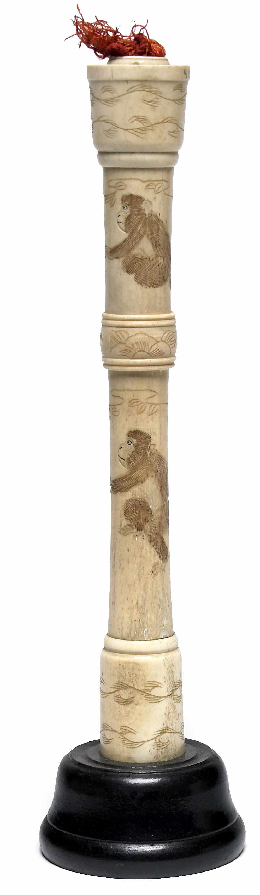 Appraisal: A Japanese bone candlestick incised with monkeys late Meiji Periodheight