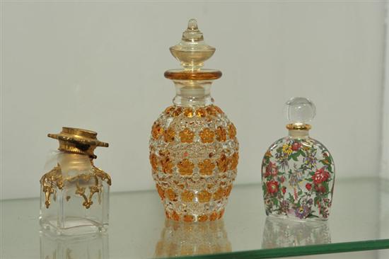 Appraisal: THREE GLASS PERFUMES A clear and amber perfume with embossed