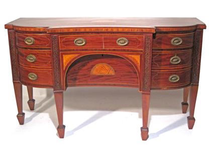 Appraisal: Inlaid mahogany side boardThe shaped top inlaid with flowerheads at