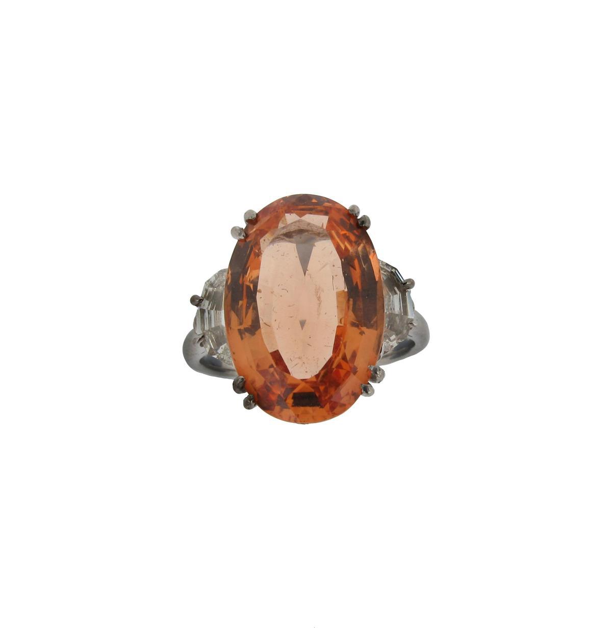 Appraisal: A topaz and diamond set ring