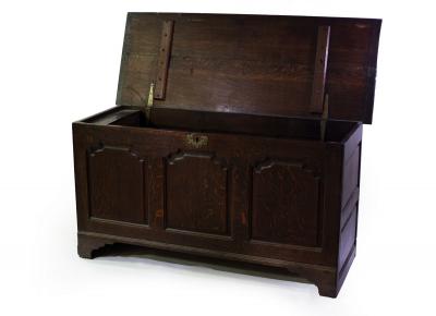 Appraisal: An th Century oak coffer with triple panel front on