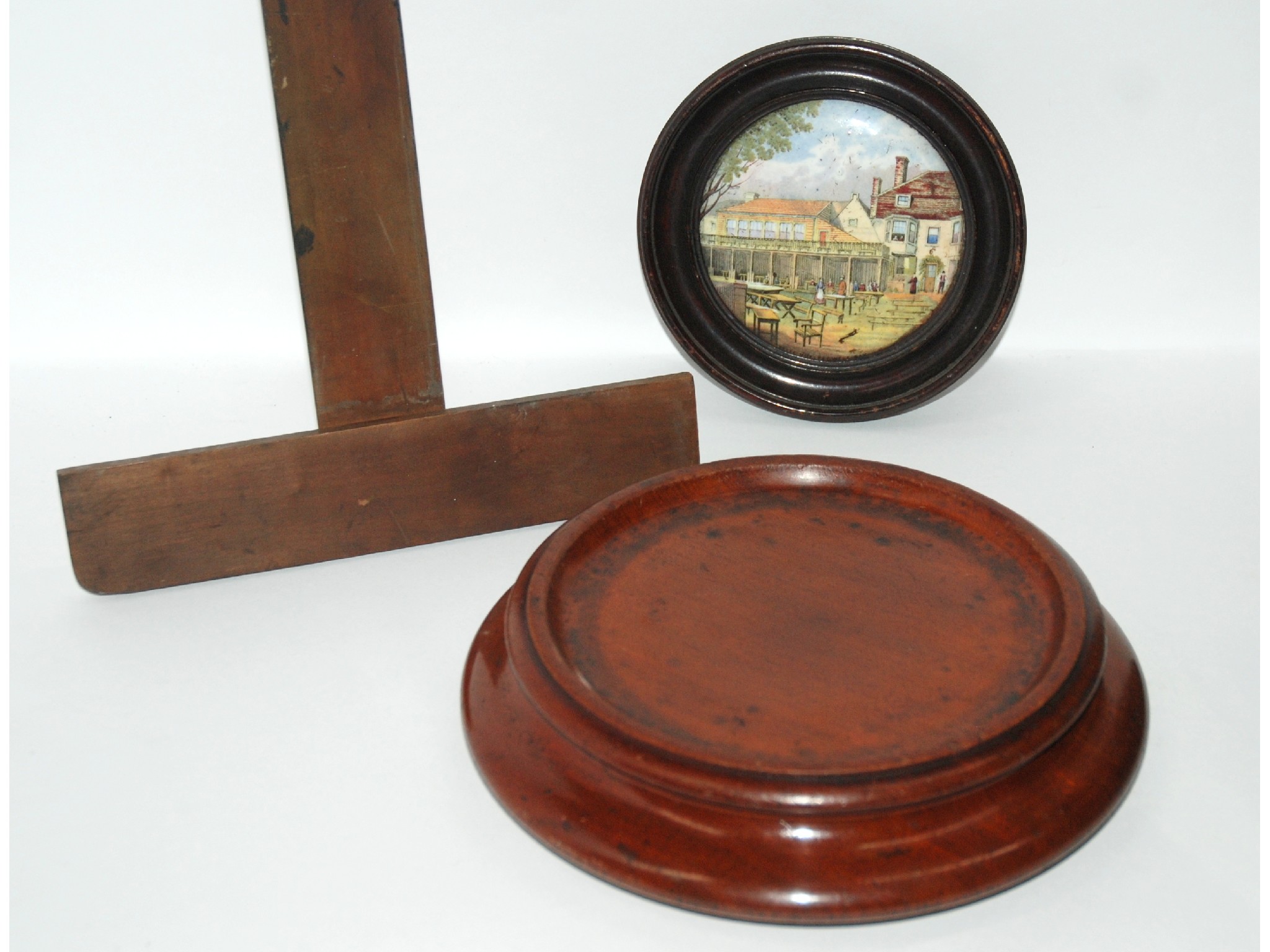 Appraisal: A tray lot including mahogany circular cheese coaster framed pot