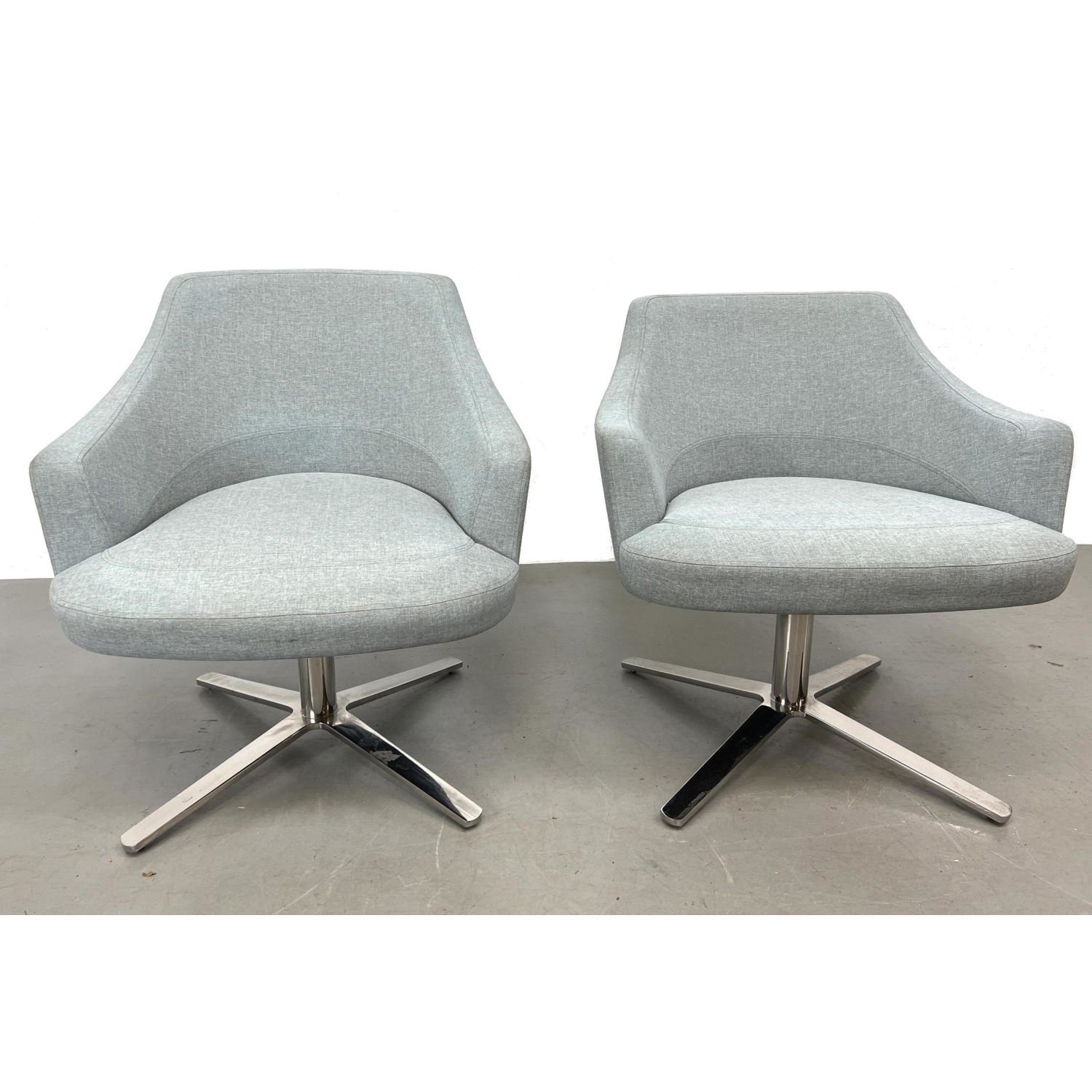 Appraisal: Pr CUMBERLAND Swivel Lounge Chairs Pale gray upholstered chairs on