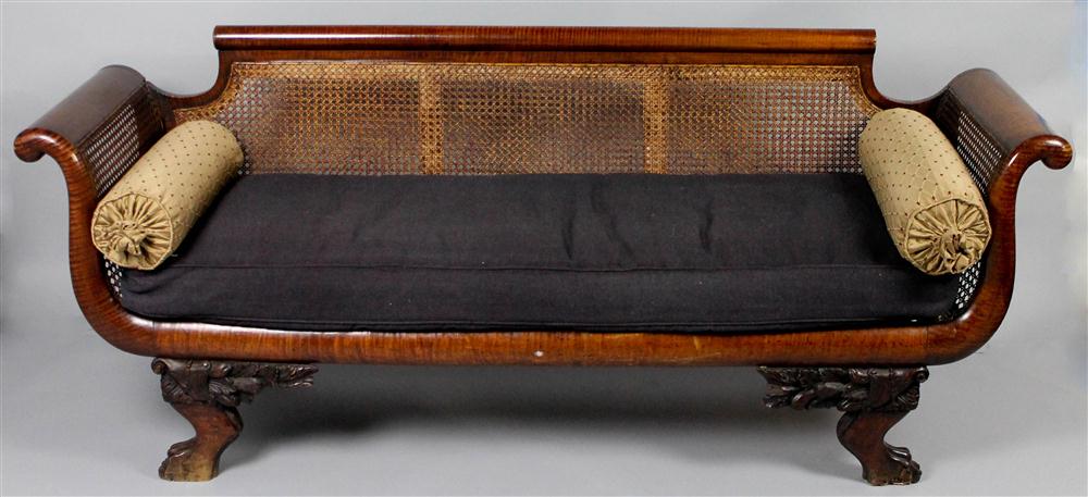 Appraisal: CLASSICAL TIGER MAPLE CANED SETTEE having a rounded straight crest