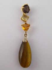 Appraisal: A yellow metal tests carat gold tiger's eye citrine smokey